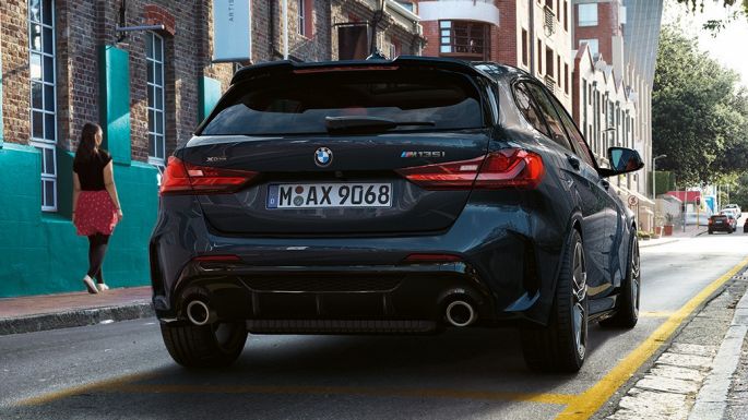 BMW M135i xDrive, rear view. BMW M135i xDrive in Black Sapphire metallic, rear view parking.