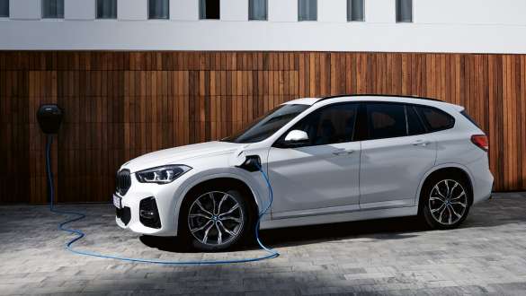 Plug-in hybrid BMW X1 xDrive25e F48 LCI three-quarter side view Plug-in hybrid BMW X1 xDrive25e F48 LCI three-quarter side view charging