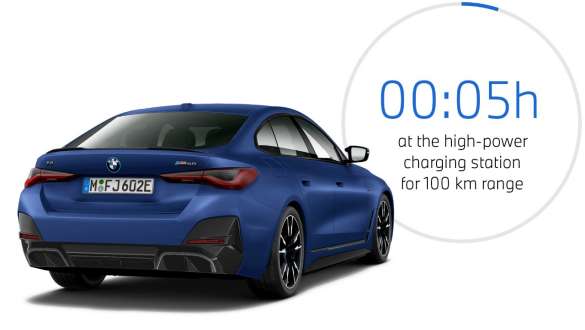 BMW i4 M50 eDrive40 G26 2021 BMW Individual Frozen Portimao Blue metallic three-quarter rear view with charging time graphic