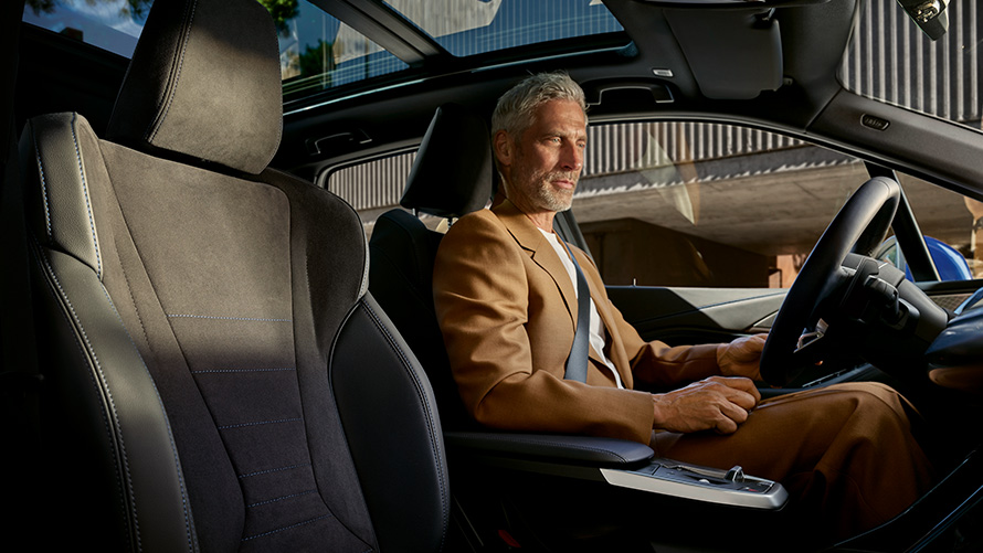 BMW 2 Series Active Tourer with mild hybrid technology U06 2021  BMW 2 Series Active Tourer with mild hybrid technology U06 2021 cockpit with person behind the steering wheel