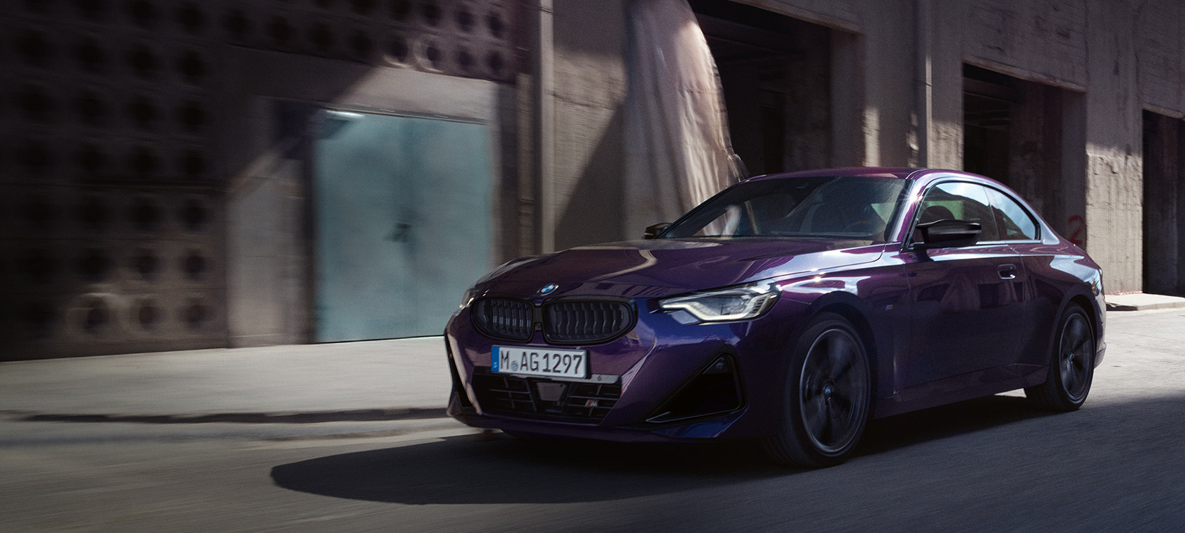 BMW 2 Series Coupé G42 2024 Thundernight metallic three-quarter front view driving 