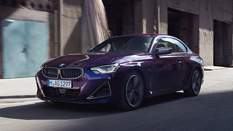 BMW 2 Series Coupé G42 three-quarter front view driving on the street BMW 2 Series BMW 2 Series Coupé G42 three-quarter front view driving on the street