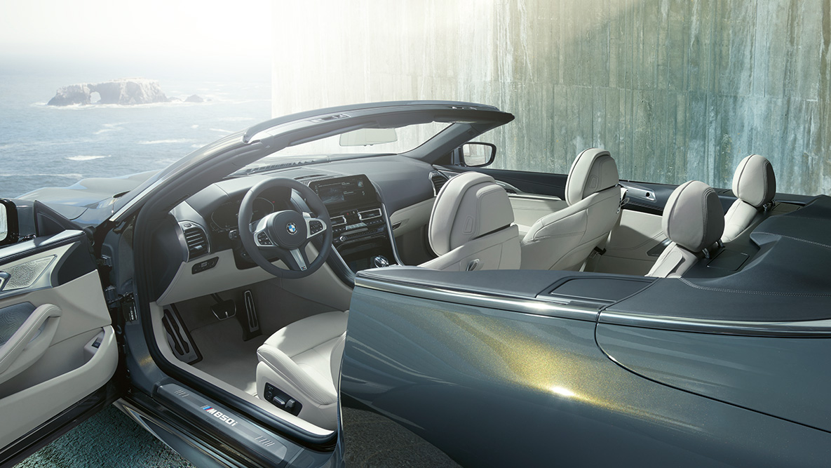 BMW M850i xDrive Dravit Grey metallic, interior, soft top and door open. BMW M850i xDrive Dravit Grey metallic, interior, soft top and door open.