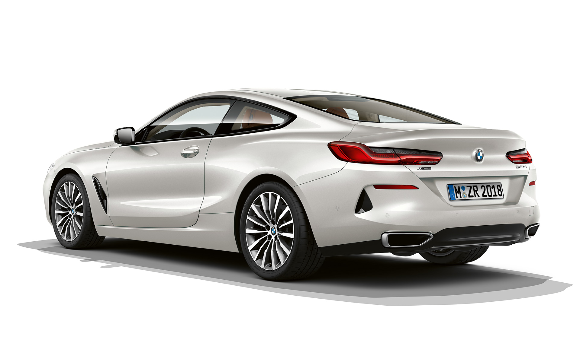 BMW 8 Series Coupé, Mineral White metallic Still shot of the BMW 8 Series Coupé in Mineral White metallic against a white background.