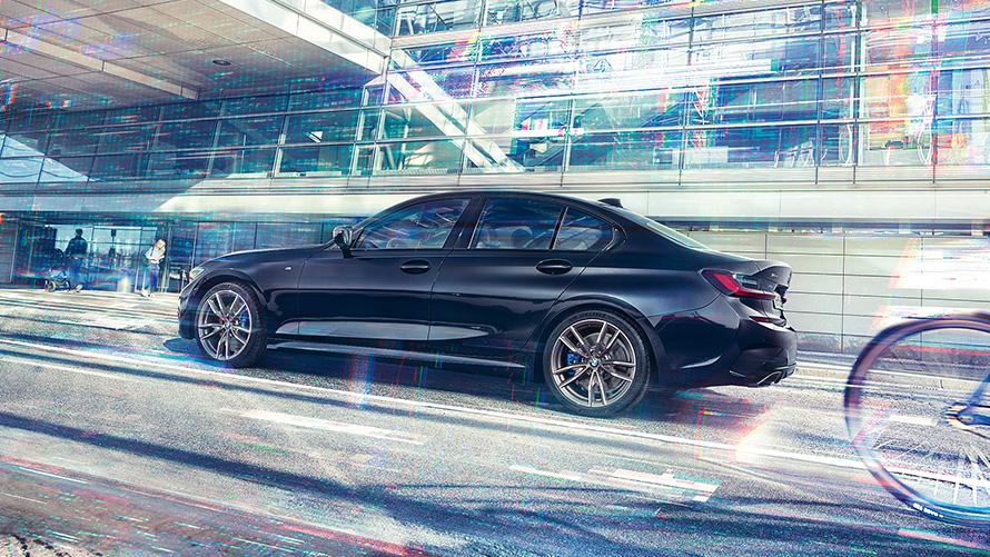 BMW M340i xDrive Sedan G20 2020 Sapphire Black metallic side view in motion