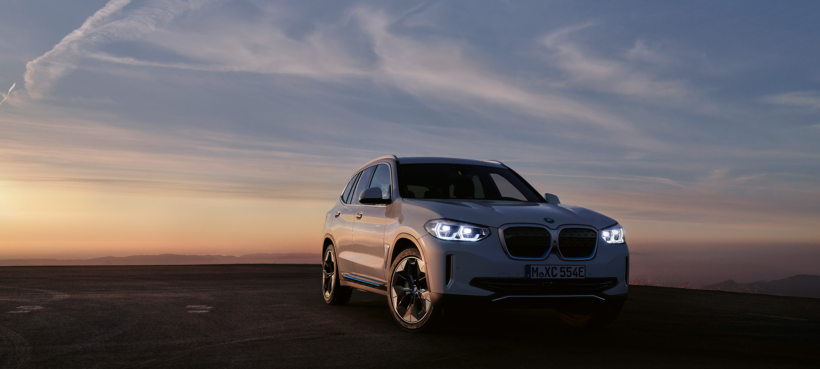 BMW iX3 G08 2020 three-quarter front view BMW iX3 G08 2020 three-quarter front view standing in evening mood