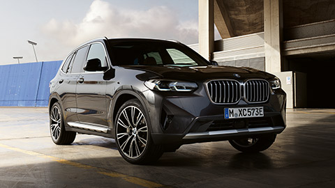 BMW X3 G01 three-quarter front view driving on the street  BMW X Series BMW X3 G01 three-quarter front view driving on the street