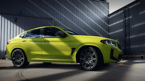 BMW X4 M Automobiles G02 MP three-quarter front view standing with model BMW X Series BMW X4 M Automobiles G02 MP three-quarter front view standing with model