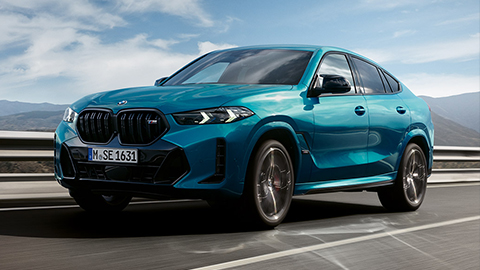 BMW X6 G06 three-quarter front view BMW X Series BMW X6 G06 three-quarter front view driving on the street