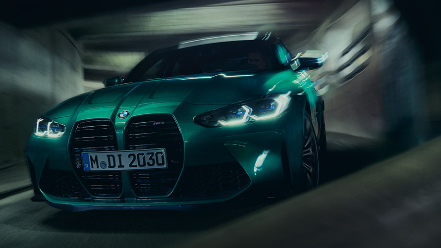 BMW M3 Competition Sedan G80 2021 BMW Individual Isle of Man Green metallic three-quarter driving a bend