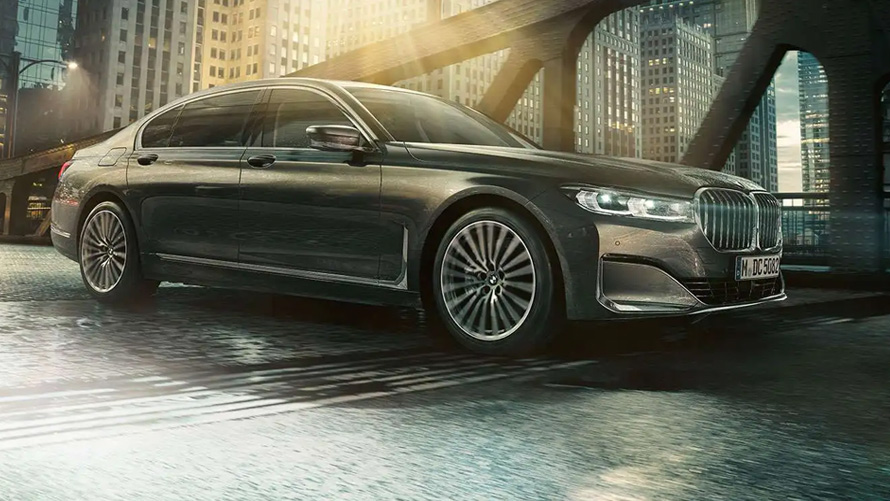 BMW M760Li xDrive Sedan G11 G12 2019 Frozen Dark Silver metallic three-quarter side view in urban setting 