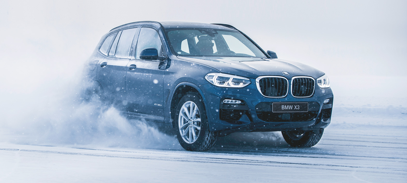 BMW Autumn and Winter Accessories BMW X3 in the snow three-quarter front view
